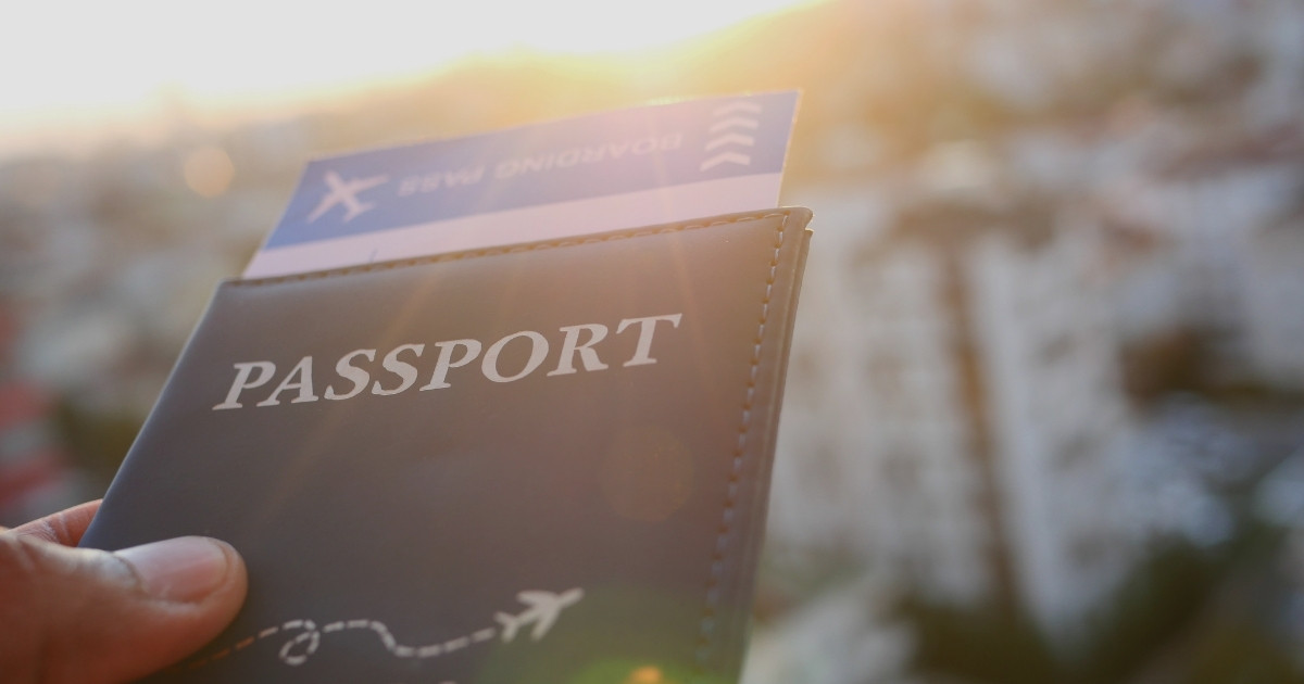 Passport and boarding pass showing travel documents needed for entry requirements